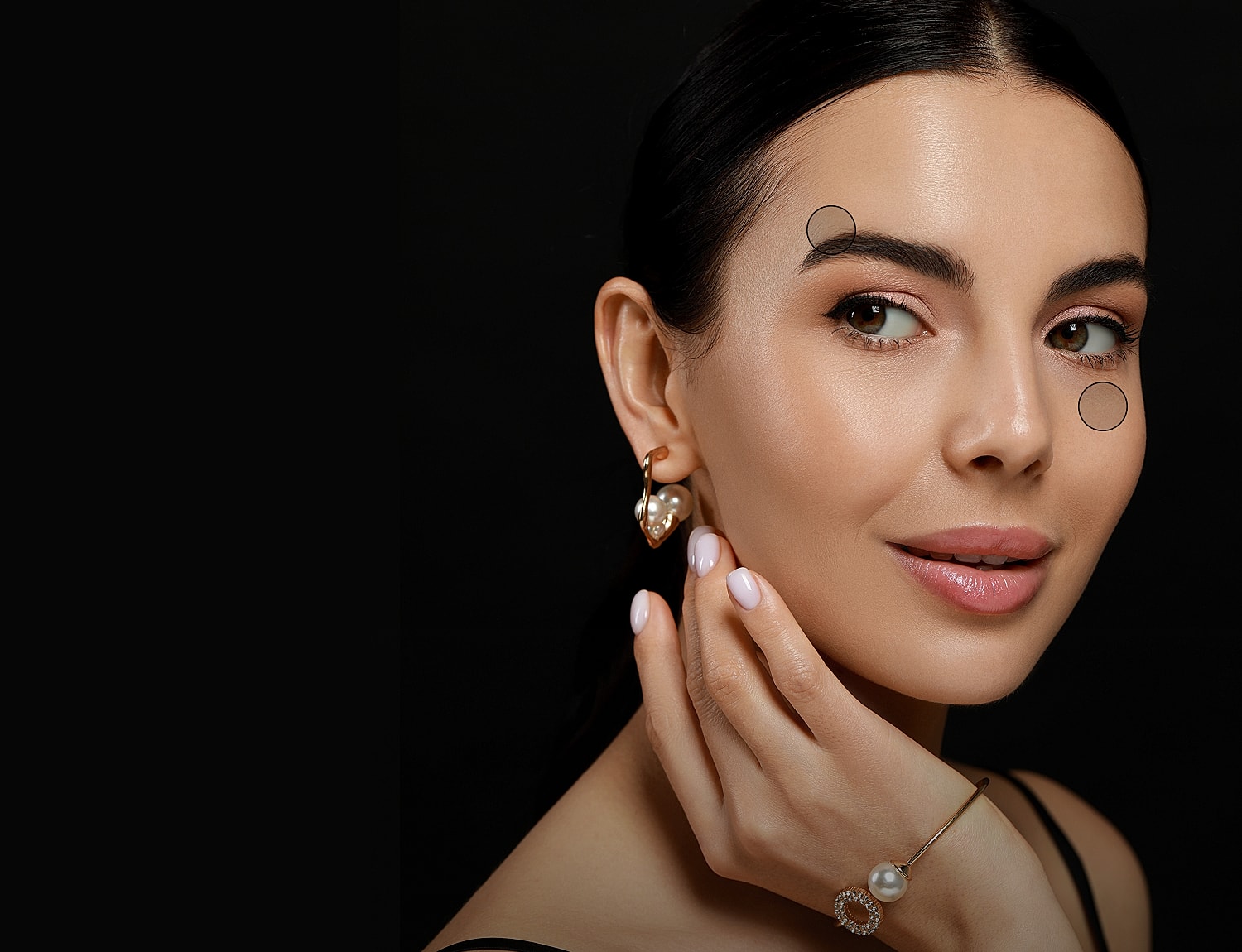 Elegant woman with polished makeup and jewelry.