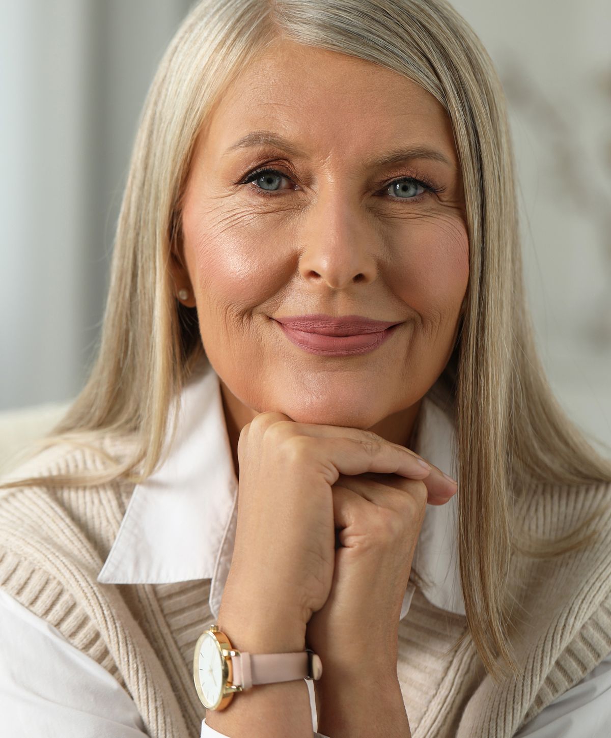 Stylish woman in a jacket, posing thoughtfully.
