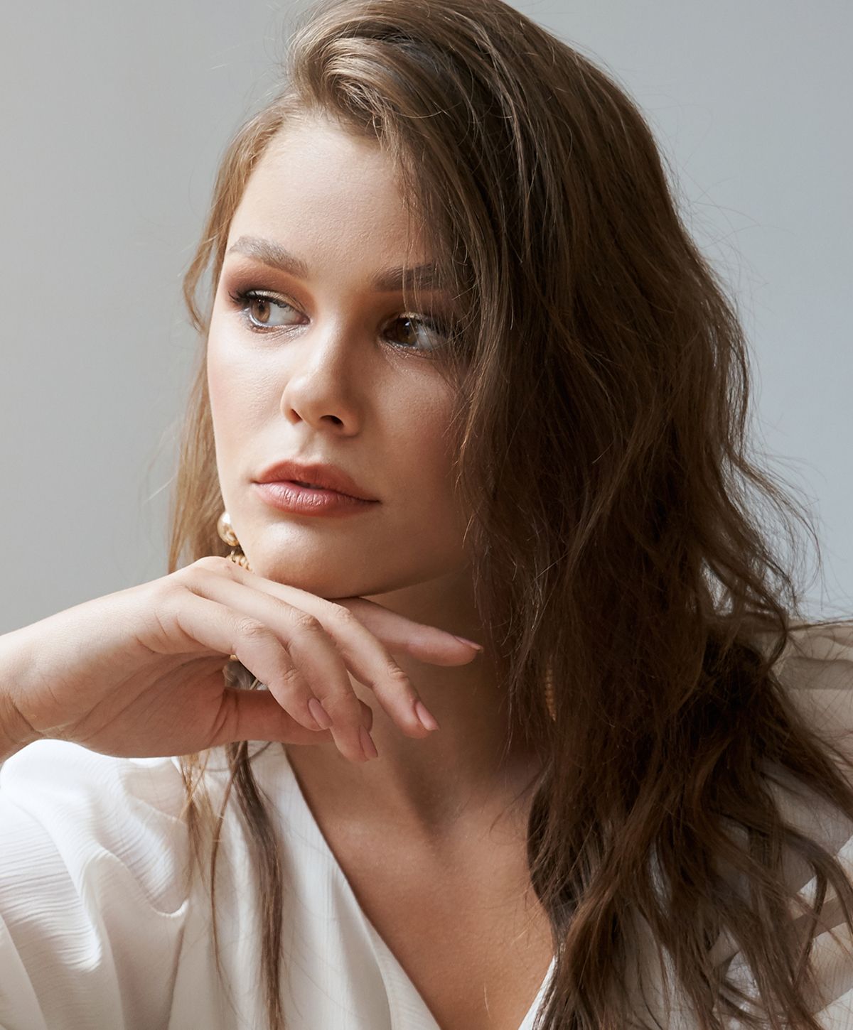 Portrait of a woman with thoughtful expression.