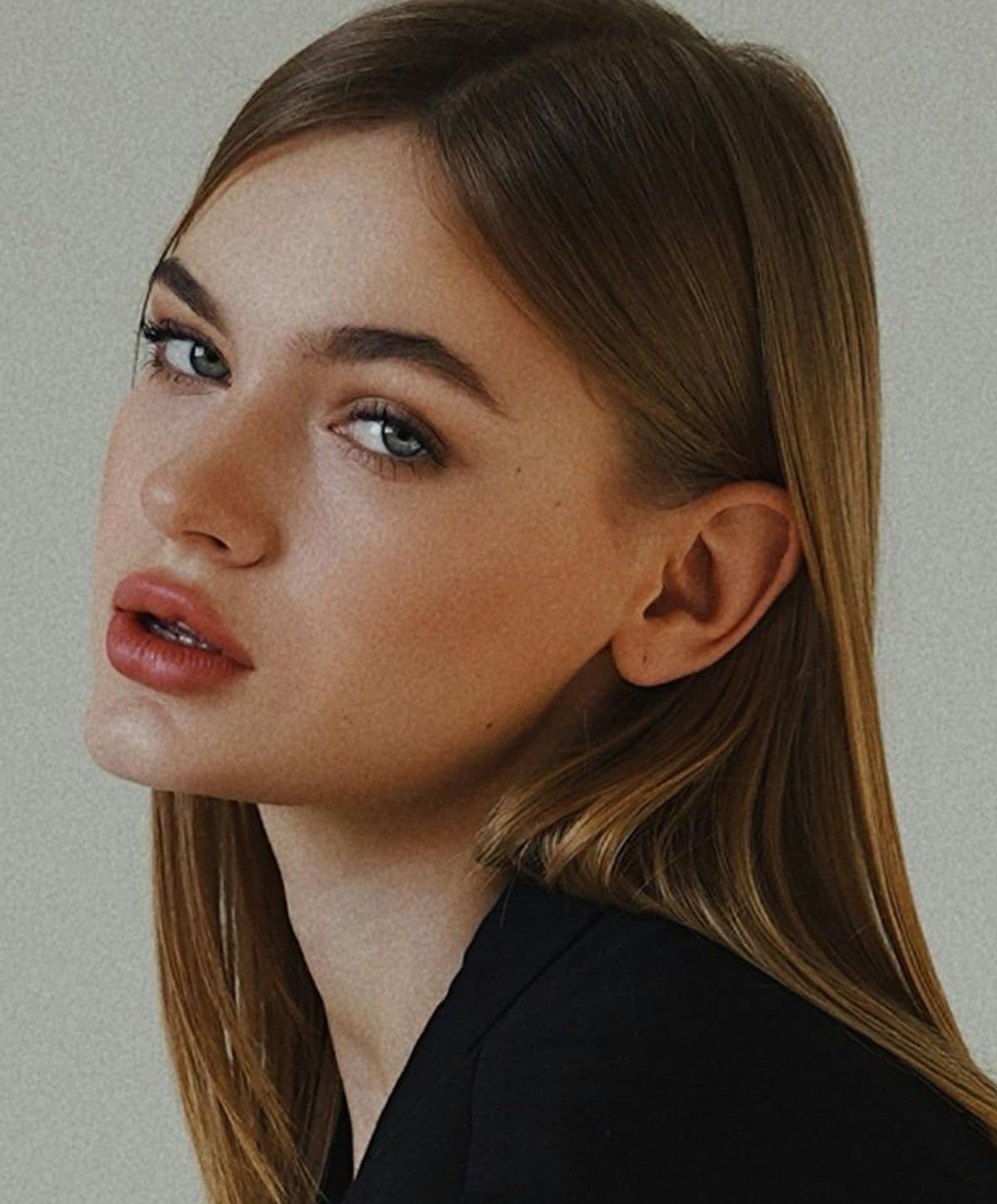 Profile portrait of a woman with long hair.