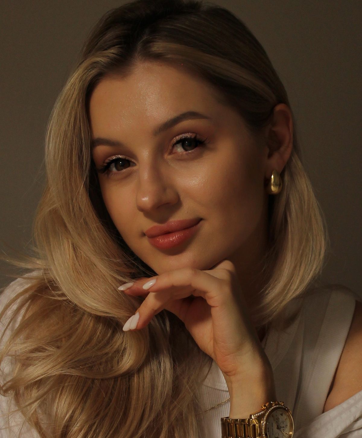 Portrait of a woman with long blonde hair.