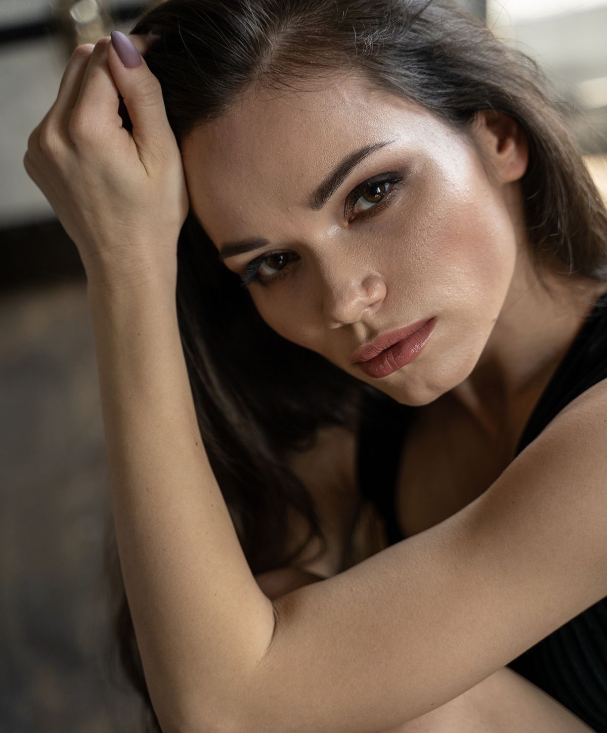 Woman with short hair in soft sunlight.