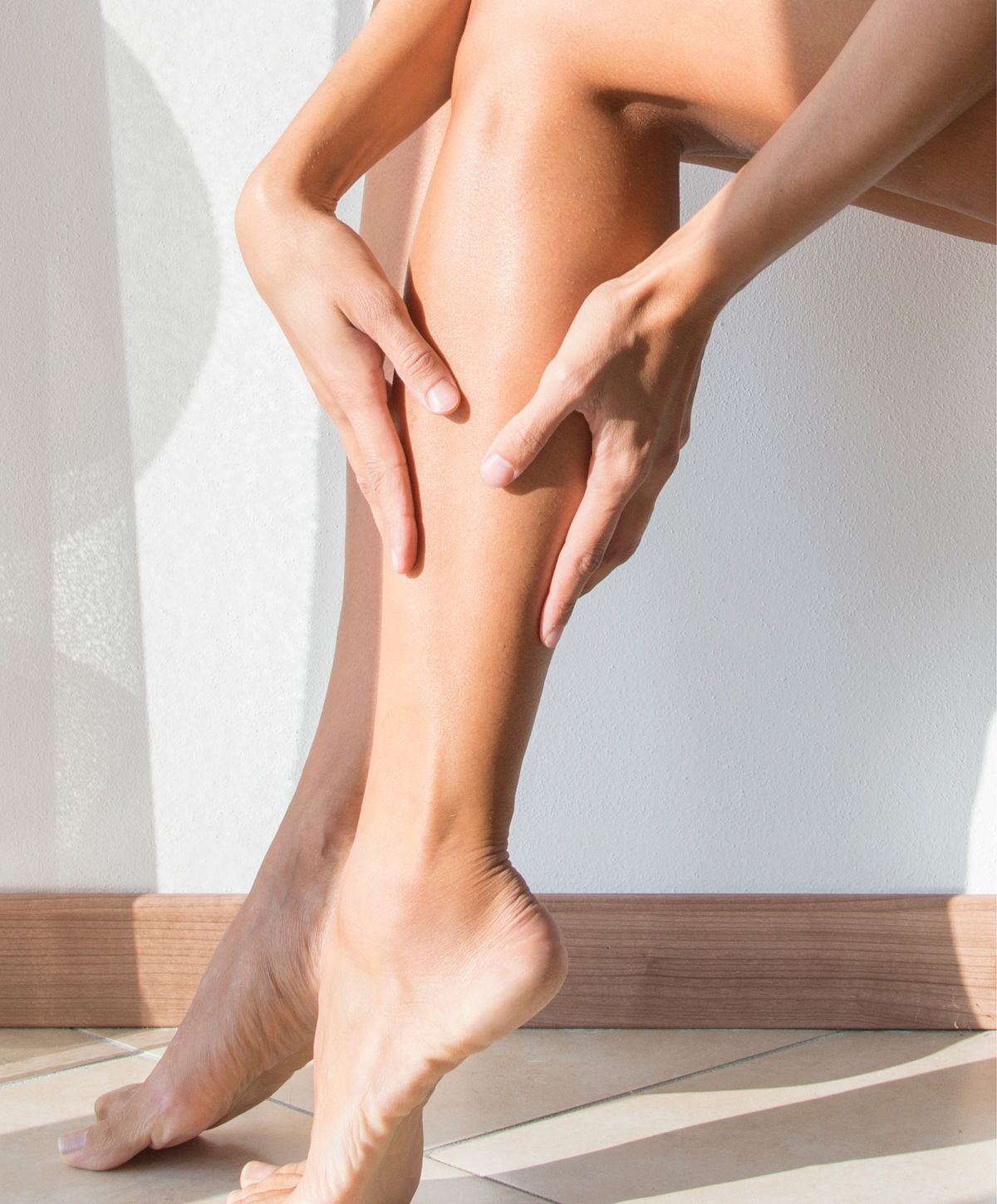 Woman with short hair in soft sunlight.
