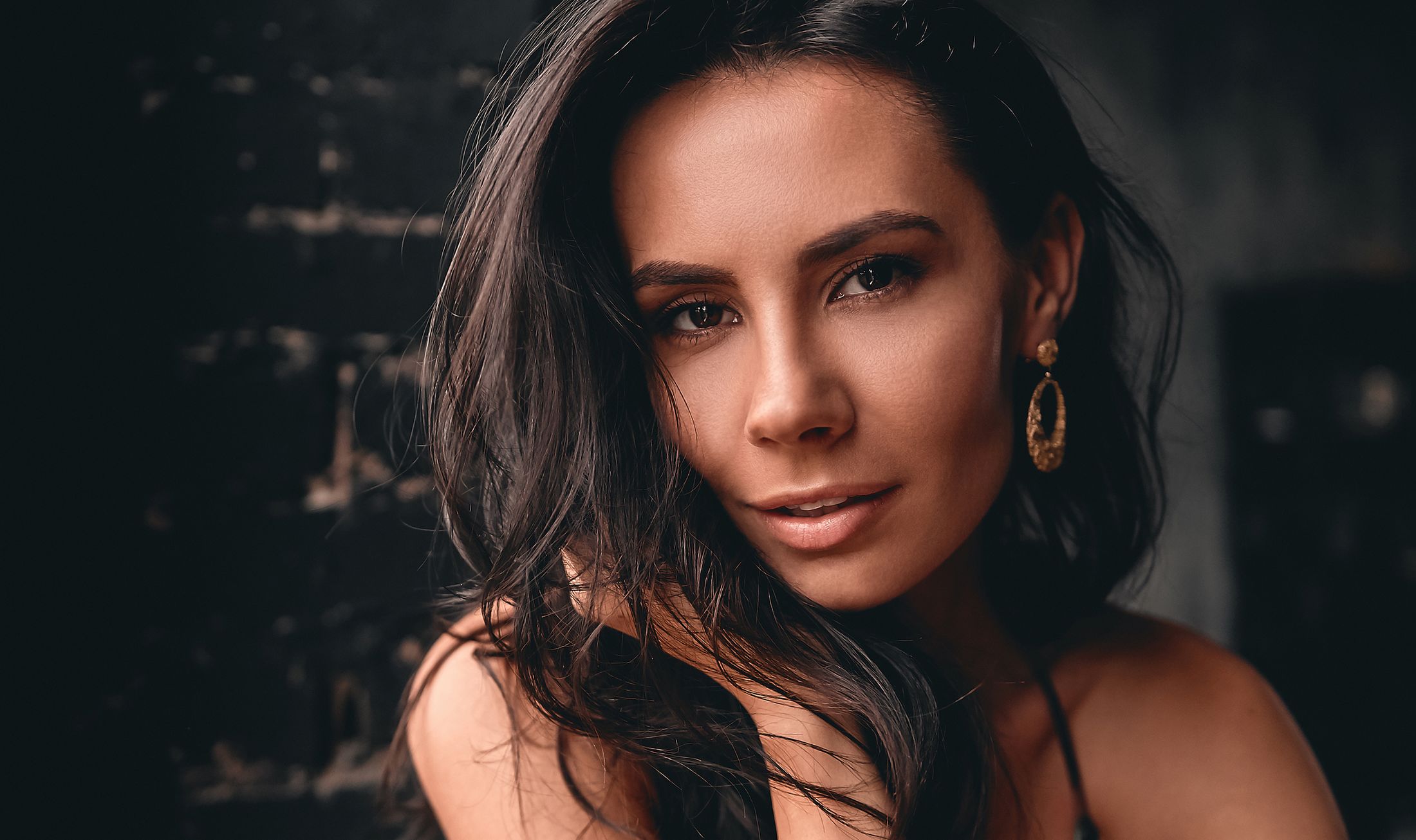Close-up portrait of a woman with dark hair.