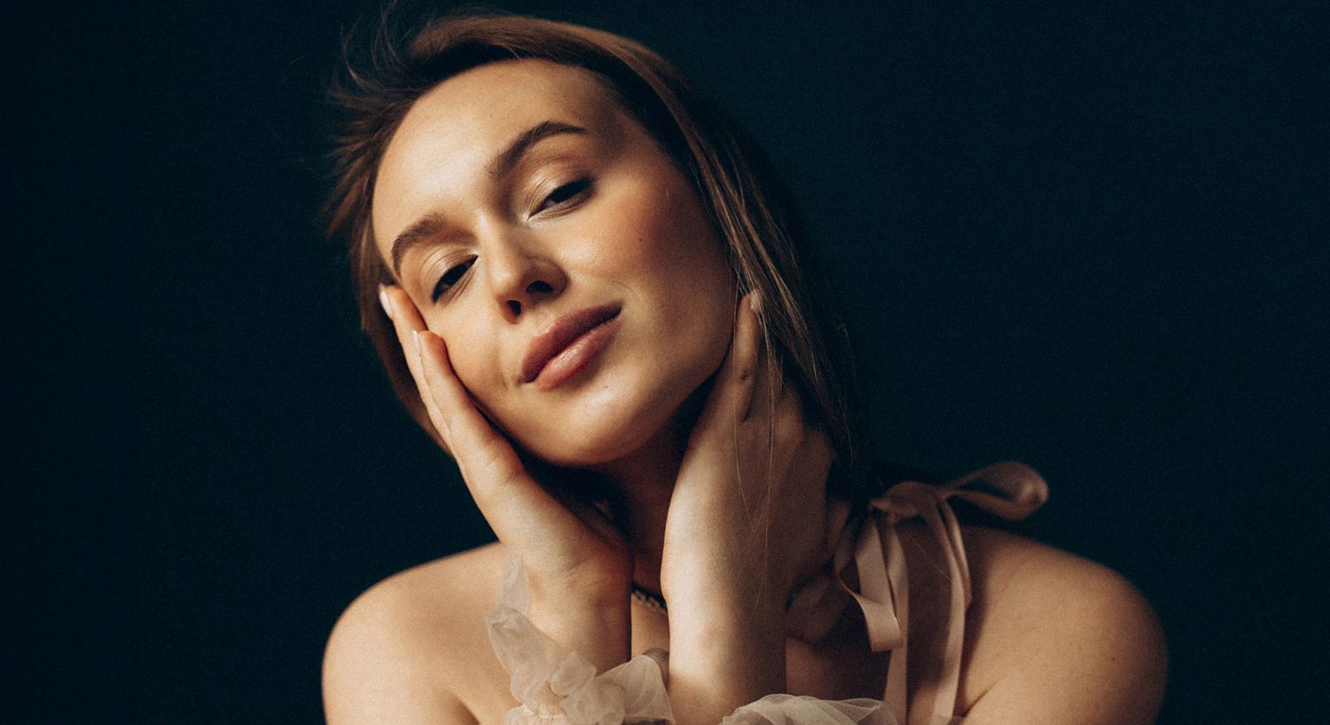 Portrait of a woman with a soft expression.